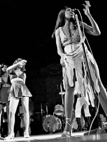 Tina Turner, Claudia Lennear, and The Ikettes performing on stage.