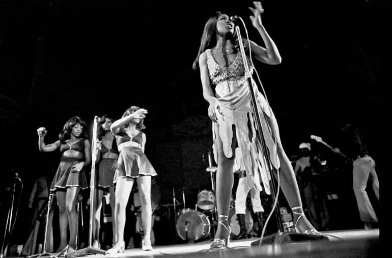 Tina Turner, Claudia Lennear, and The Ikettes performing on stage.