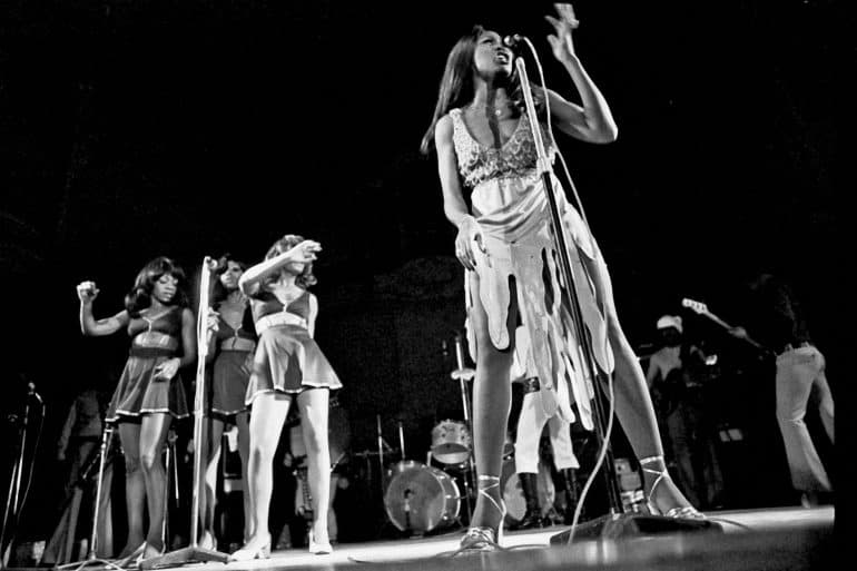 Tina Turner, Claudia Lennear, and The Ikettes performing on stage.