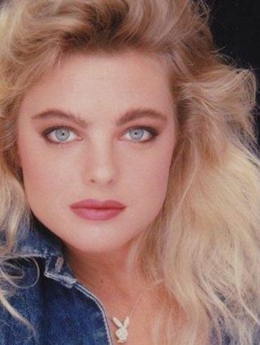 Erika Eleniak model and actress posing for photograph.