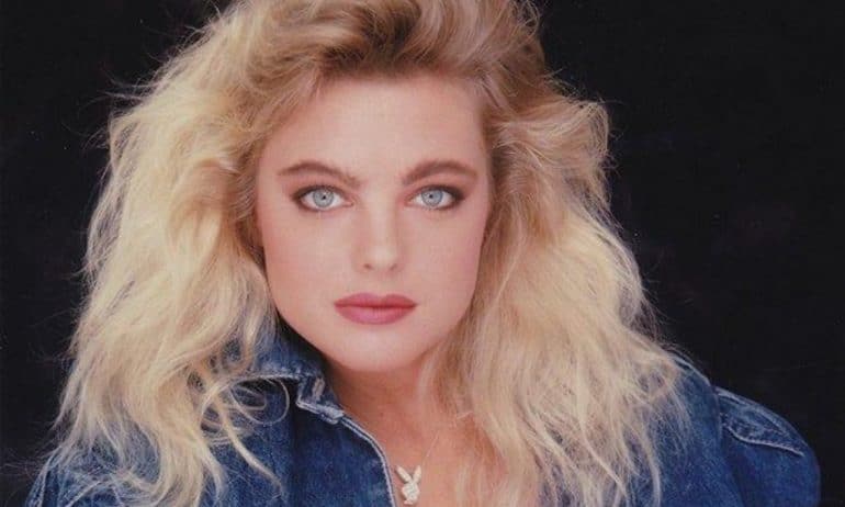 Erika Eleniak model and actress posing for photograph.