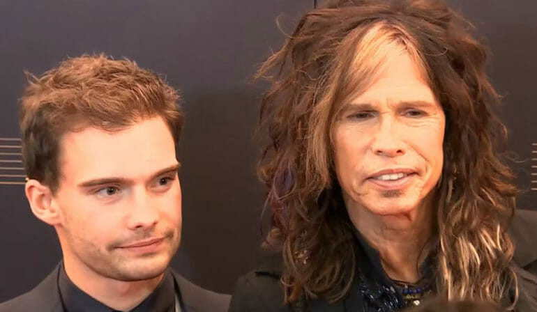 Singer Steven Tyler and his son Taj Tyler arrive for the premiere of