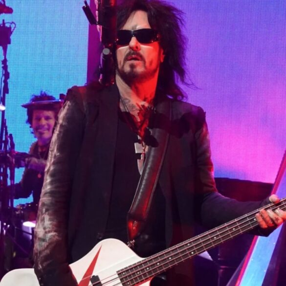 Nikki Sixx’s Net Worth in 2026 - Music, Business and Earnings Nikki Sixx in sunglasses plays a white bass guitar onstage