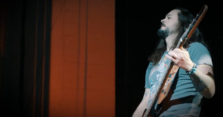 Rock Star playing a guitar on a stage