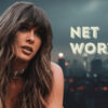 A woman with long wavy hair in front of a blurred city skyline at night, with the words “Net Worth” beside her