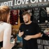 Woman buying band merch at the concert