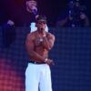 Ja Rule performs shirtless on stage during a 2025 concert