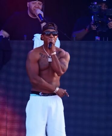 Ja Rule performs shirtless on stage during a 2025 concert