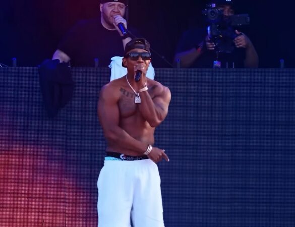 Ja Rule performs shirtless on stage during a 2025 concert