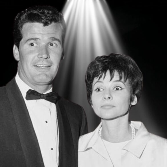 Black-and-white photo of James Garner and his wife Lois Clarke standing together under a spotlight