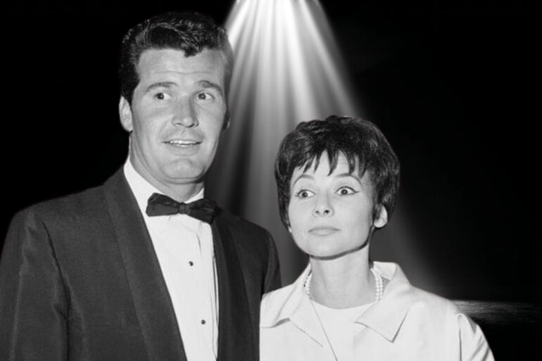 Black-and-white photo of James Garner and his wife Lois Clarke standing together under a spotlight