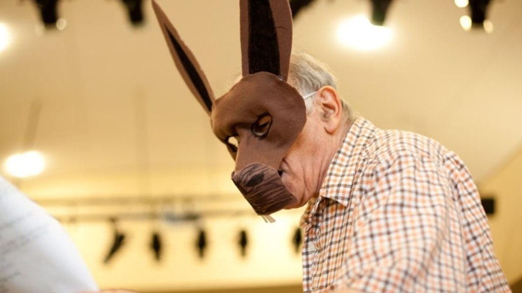 The Final Encore: Retired Celebrities Find a Stage at the Lillian Booth Actors' Home Resident performs as Nick Bottom, donkey mask and all, in a charming home theater setting
