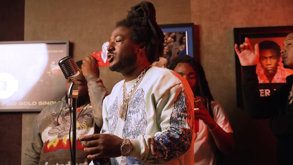 Hip hop artist performing in a small studio space