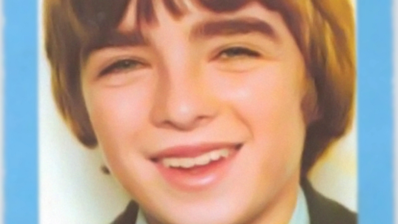 Noel Gallagher Biography - The Songwriter Who Defined Britpop Noel Gallagher as a young boy smiling in a school photo