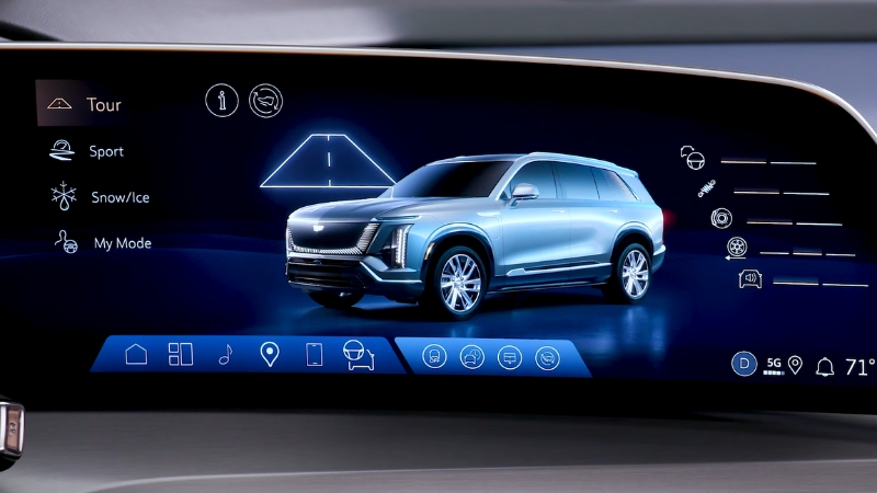 Do the Driving Modes in the Cadillac Lyriq Offer Different Ranges or Battery Usages? Cadillac Lyriq infotainment screen showing Tour, Sport, Snow/Ice, and My Mode driving modes