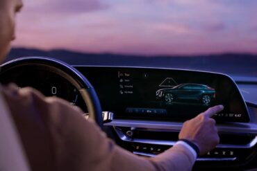 Driver selecting a driving mode on the Cadillac Lyriq infotainment screen