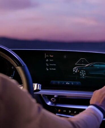 Driver selecting a driving mode on the Cadillac Lyriq infotainment screen