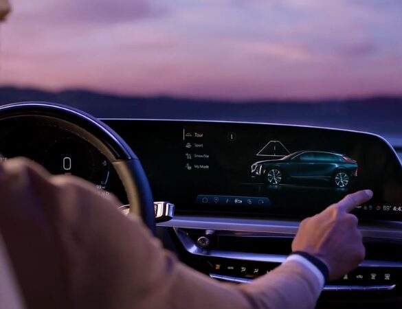 Driver selecting a driving mode on the Cadillac Lyriq infotainment screen