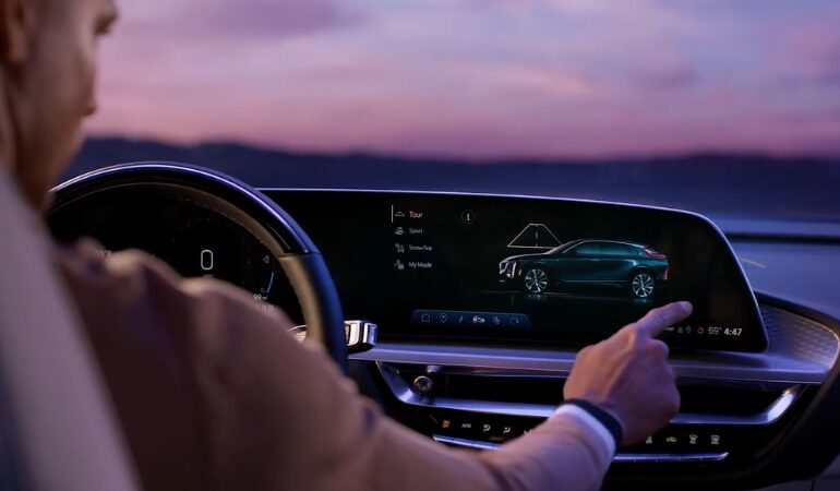 Driver selecting a driving mode on the Cadillac Lyriq infotainment screen