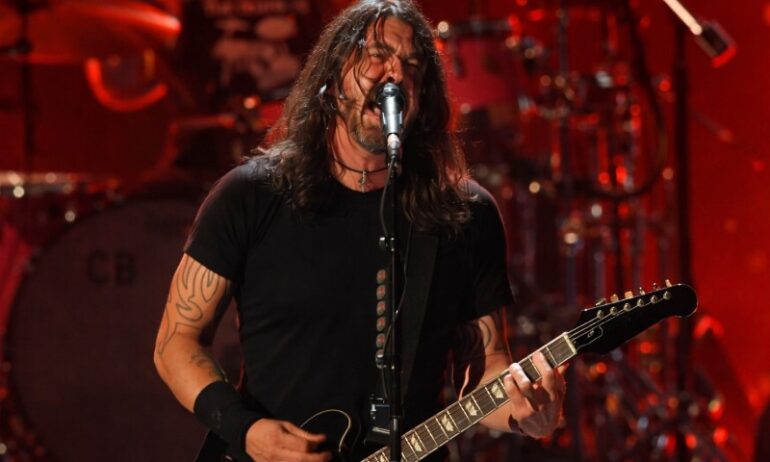 Foo Fighters Your Favorite Toy - Release Date, Tracklist, and What To Expect Dave Grohl passionately performs on stage, singing into a mic