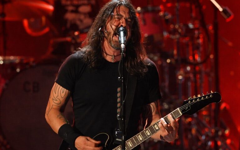 Foo Fighters Your Favorite Toy - Release Date, Tracklist, and What To Expect Dave Grohl passionately performs on stage, singing into a mic