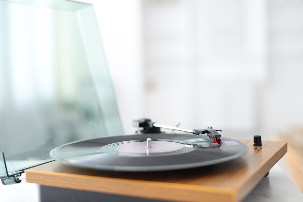 You Can Enjoy Better Sound At Home Without Spending a Fortune - Here Are 7 Budget Music Gear Picks turntable with vinyl record