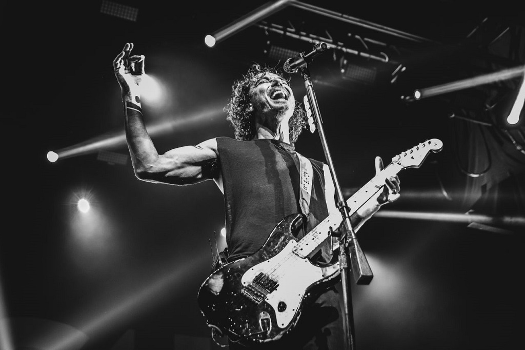 The Connection Between Classical and Rock Music - When Rock Bands Used Classical Instruments Guitarist performing live on stage