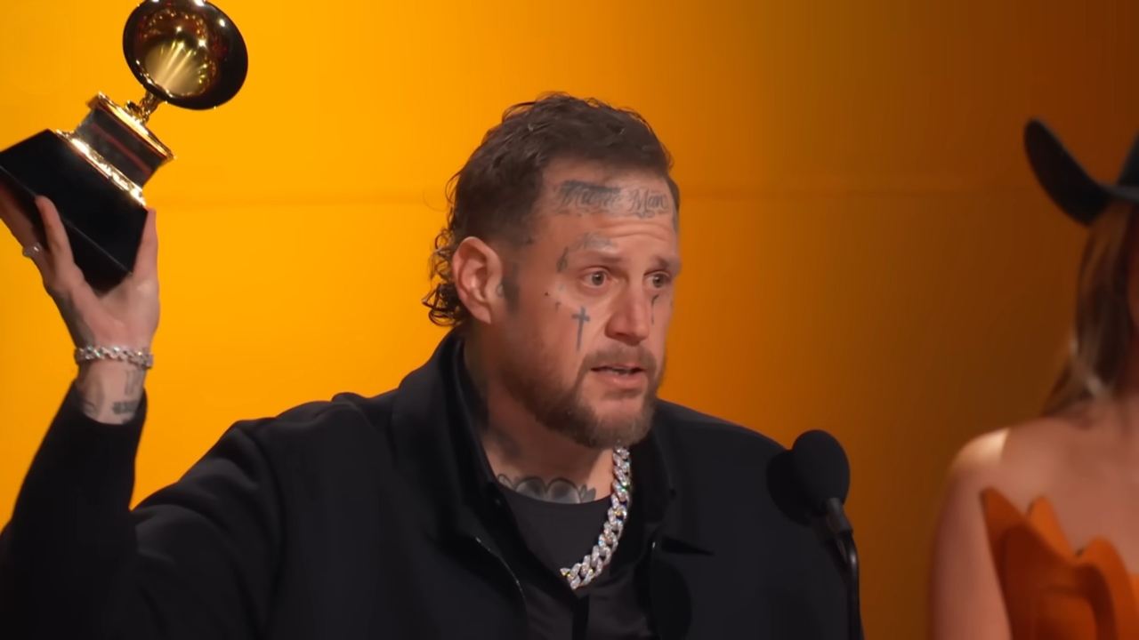 Jelly Roll Bio - Age, Family, Marriage and Fame Jelly Roll raises a Grammy trophy during an awards speech
