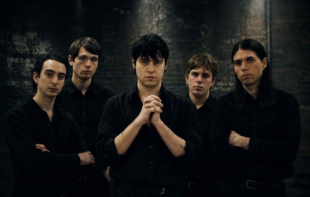 115 Post-Punk Bands From the 2010s, The Records That Kept the Genre Alive Iceage post-punk band posing together in black shirts.