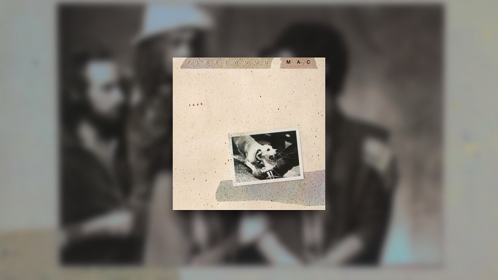 10 Classic Rock Albums Everyone Hated Before They Became Cult Classics Fleetwood Mac’s Tusk album cover displayed over a blurred photograph of the band