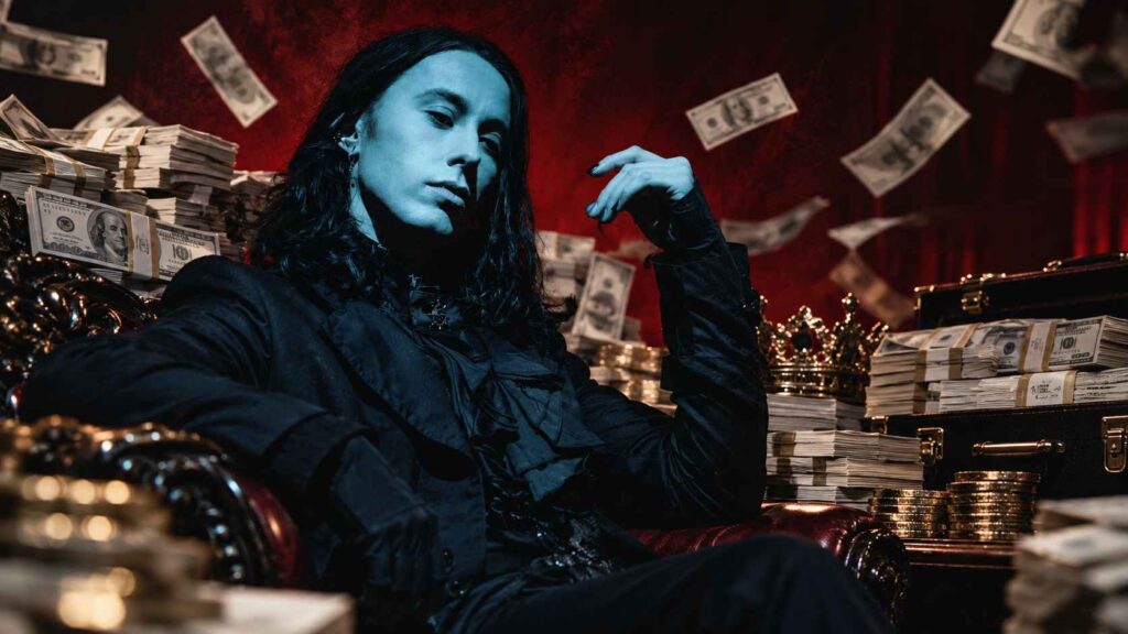 Ronnie Radke Bio - Prison, Escape the Fate and the Rise of Falling in Reverse Ronnie Radke seated with stacks of cash in the background.