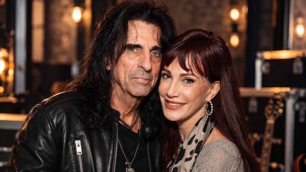 Alice Cooper and Sheryl Goddard, The Tour Romance That Became a Marriage of Nearly 50 Years Alice Cooper and wife Sheryl Goddard posing together backstage.