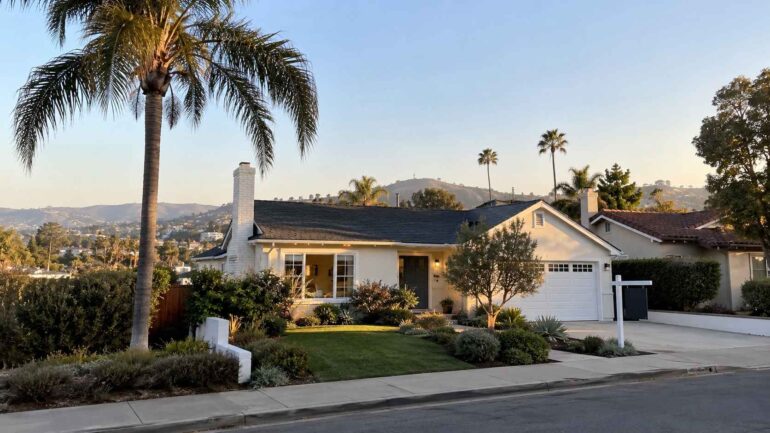 Homes in California - Single-family California home with palm trees and a landscaped front yard.