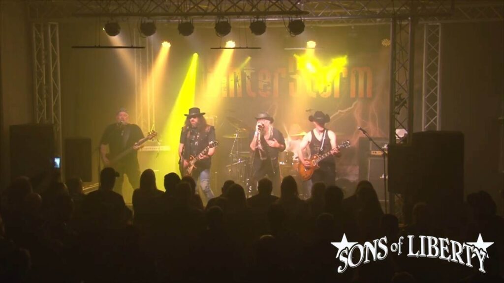 Rock band performing on stage at WinterStorm festival in Troon